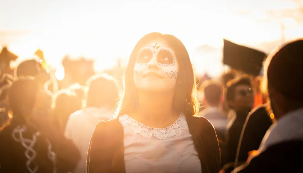 Person looking hopeful in Day of the Dead festival.